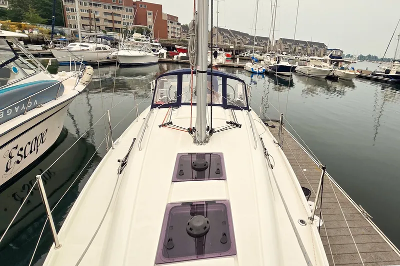 Slide: The Image of Beneteau Oceanis 30.1 sailboat docked in a marina, 2022 model. - 9