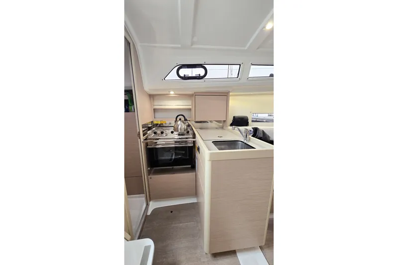 Slide: The Image of Modern kitchen interior of 2022 Beneteau Oceanis 30.1 yacht with stove and sink. - 3