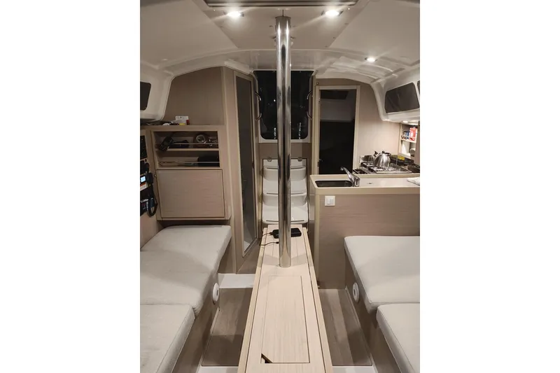 Slide: The Image of Interior of 2022 Beneteau Oceanis 30.1 yacht, featuring modern design and cozy seating. - 2