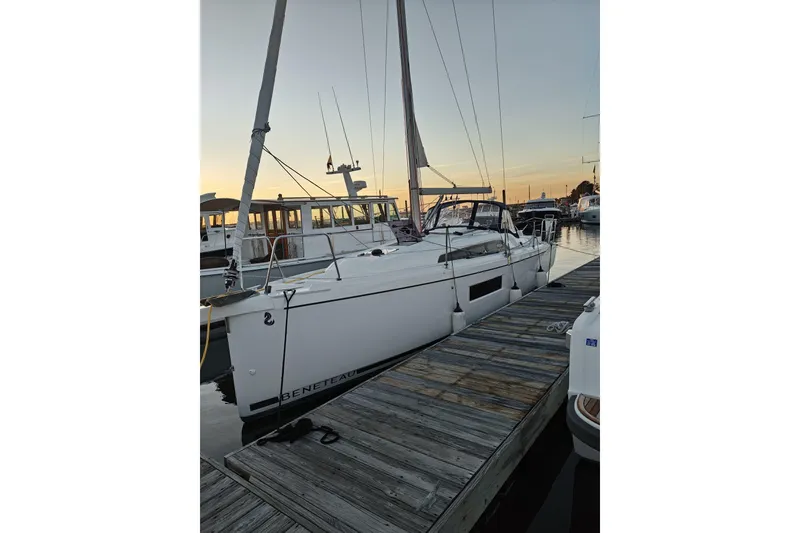 The Image of 2022 Beneteau Oceanis 30.1 sailboat docked at sunset, showcasing sleek design. - 0