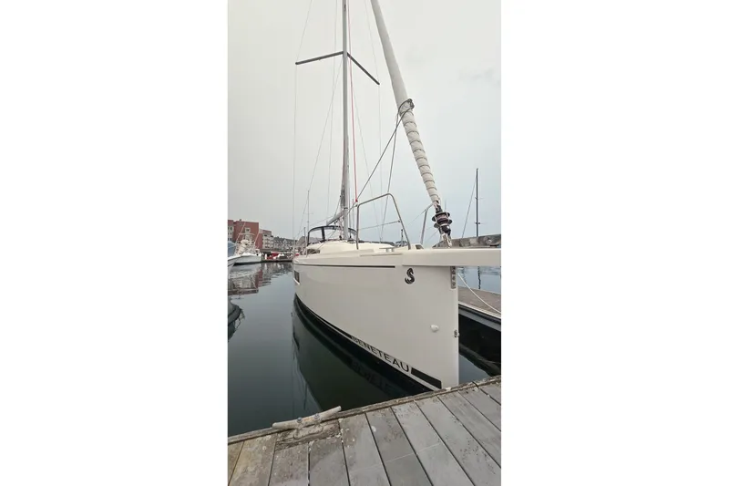 Slide: The Image of 2022 Beneteau Oceanis 30.1 sailboat docked in a marina. - 29