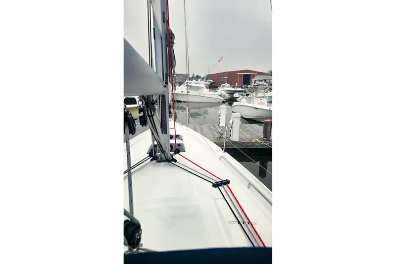 Slide: The Image of Beneteau Oceanis 30.1 sailboat docked at marina, 2022 model, overcast sky. - 7