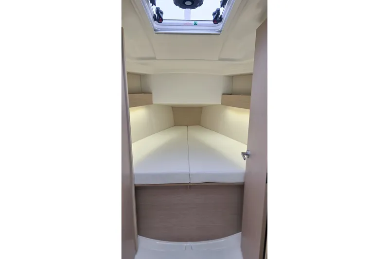 Slide: The Image of Interior cabin of 2022 Beneteau Oceanis 30.1 yacht with skylight and cozy bedding. - 22