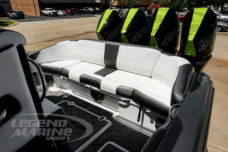 Slide: The Image of 2024 Nor-Tech 390 Sport Center Console with luxurious seating and powerful outboard engines. - 32