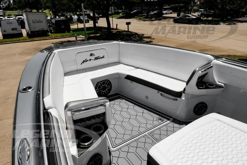 Slide: The Image of 2024 Nor-Tech 390 Sport Center Console boat interior with sleek seating and modern design. - 37