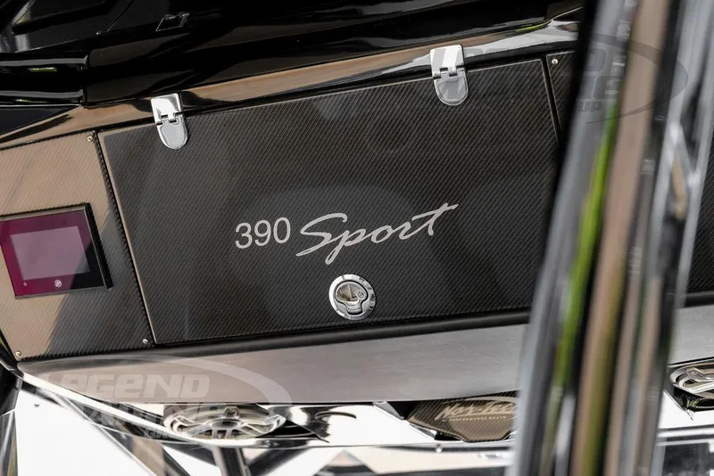 Slide: The Image of 2024 Nor-Tech 390 Sport Center Console, sleek design with carbon fiber finish and secure latches. - 20