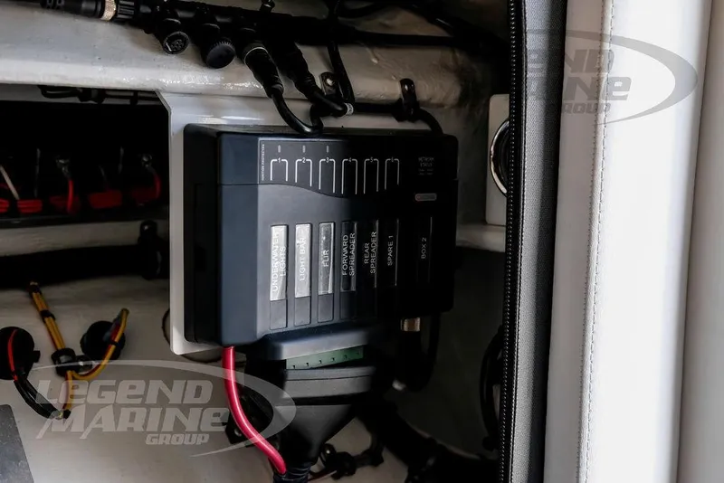 Slide: The Image of Electrical panel inside 2024 Nor-Tech 390 Sport Center Console boat, featuring labeled switches. - 59