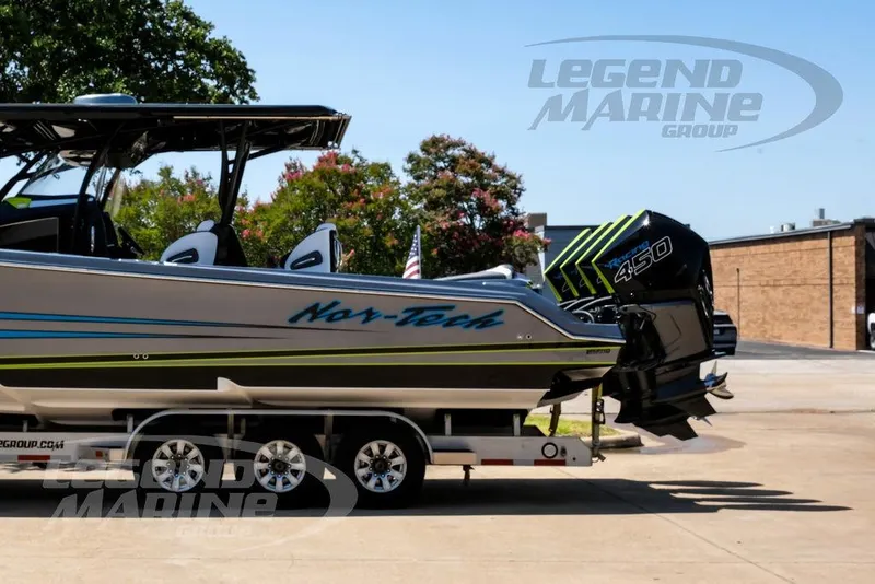 Slide: The Image of 2024 Nor-Tech 390 Sport Center Console boat on trailer, featuring powerful 450 engine. - 9