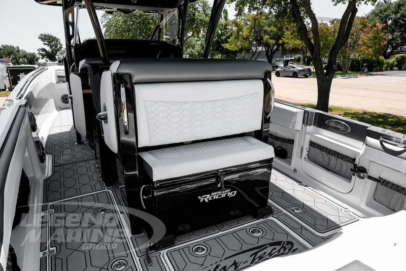Slide: The Image of 2024 Nor-Tech 390 Sport Center Console boat interior with stylish seating and modern design. - 27