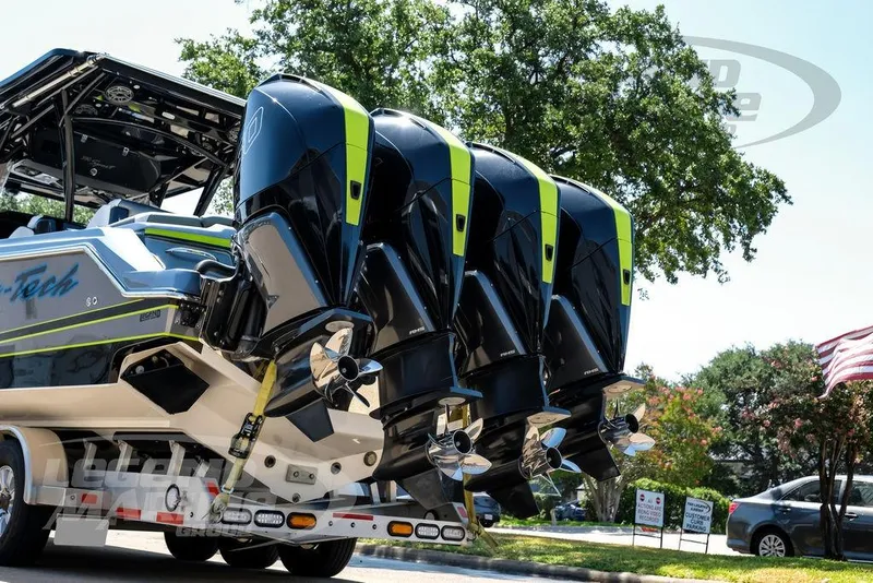 Slide: The Image of 2024 Nor-Tech 390 Sport Center Console with quad engines on a trailer. - 62