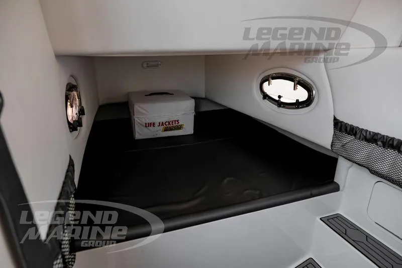 Slide: The Image of 2024 Nor-Tech 390 Sport Center Console cabin with life jackets and portholes. - 55