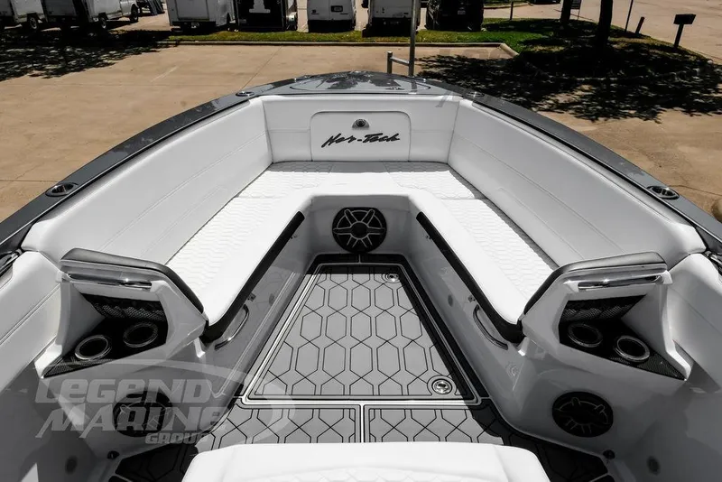 Slide: The Image of 2024 Nor-Tech 390 Sport Center Console boat interior with white seating and modern design. - 35