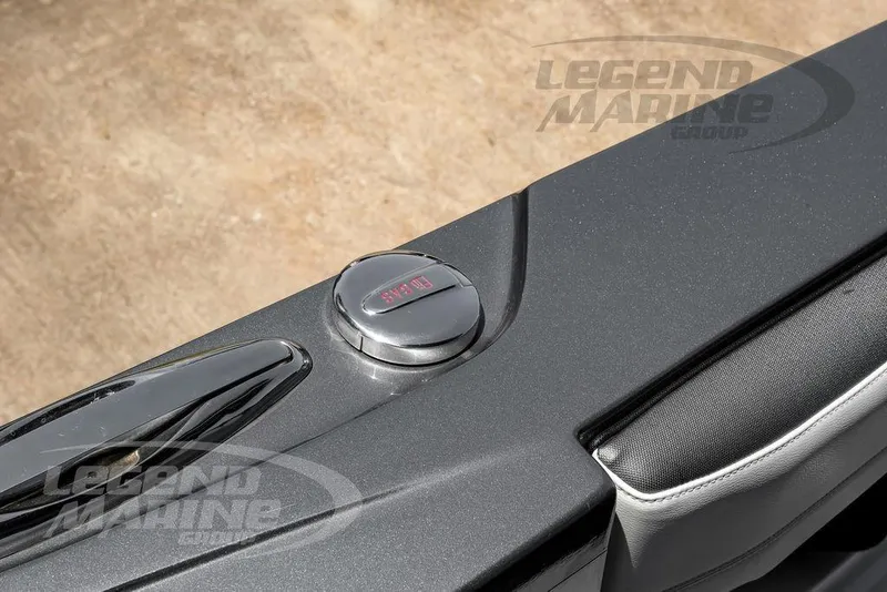 Slide: The Image of 2024 Nor-Tech 390 Sport Center Console fuel cap detail with Legend Marine Group branding. - 48