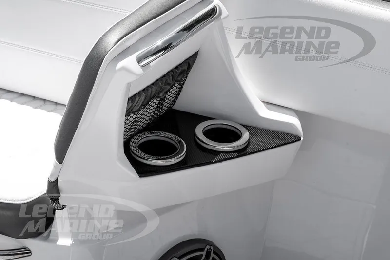 Slide: The Image of 2024 Nor-Tech 390 Sport Center Console interior with cup holders and sleek design. - 41
