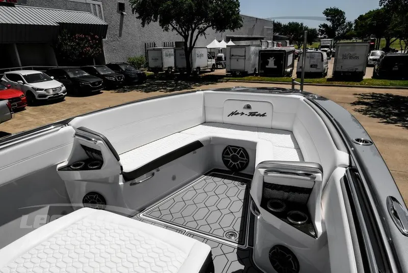 Slide: The Image of 2024 Nor-Tech 390 Sport Center Console boat with luxurious seating and modern design. - 31