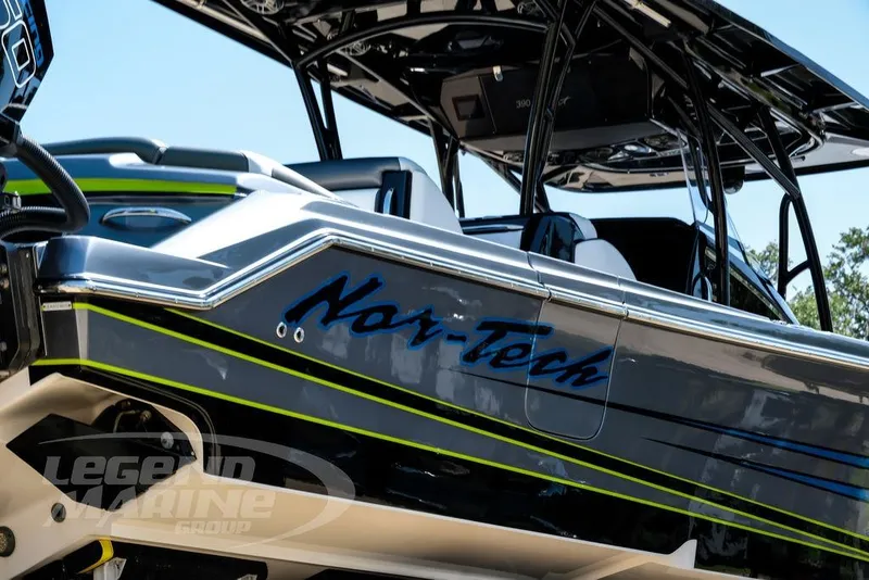 Slide: The Image of 2024 Nor-Tech 390 Sport Center Console boat with sleek design and vibrant accents. - 64