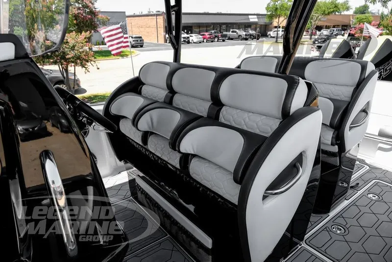 Slide: The Image of 2024 Nor-Tech 390 Sport Center Console interior with luxurious seating and modern design. - 30