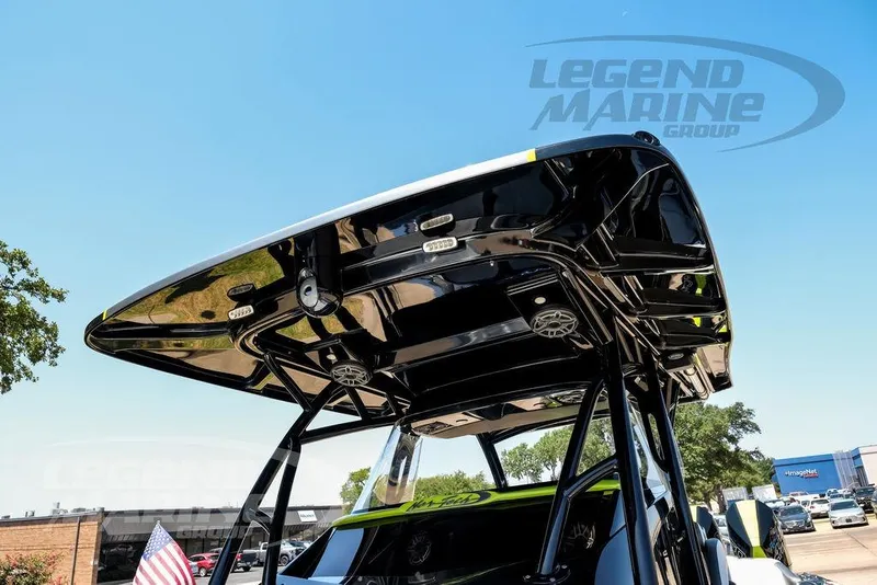 Slide: The Image of 2024 Nor-Tech 390 Sport Center Console boat with sleek black T-top design. - 18