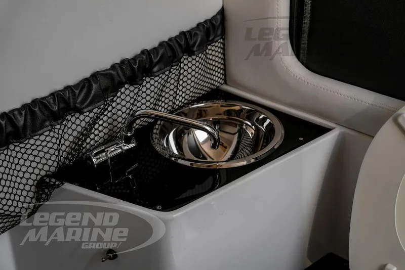 Slide: The Image of 2024 Nor-Tech 390 Sport Center Console sink with sleek chrome faucet and netted storage. - 57