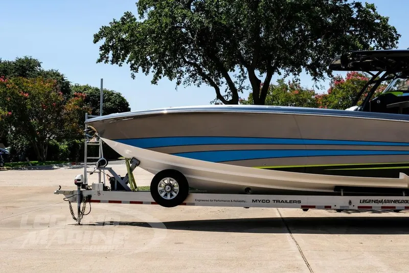 Slide: The Image of 2024 Nor-Tech 390 Sport Center Console boat on trailer, side view, outdoors. - 15