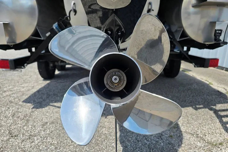 Slide: The Image of 2023 Lowe SS 210 boat propeller, close-up view, showcasing shiny metal blades. - 9