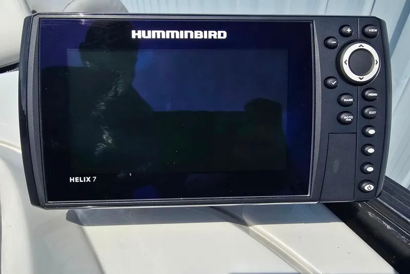 Slide: The Image of Humminbird Helix 7 fish finder on a 2023 Lowe SS 210 boat dashboard. - 11