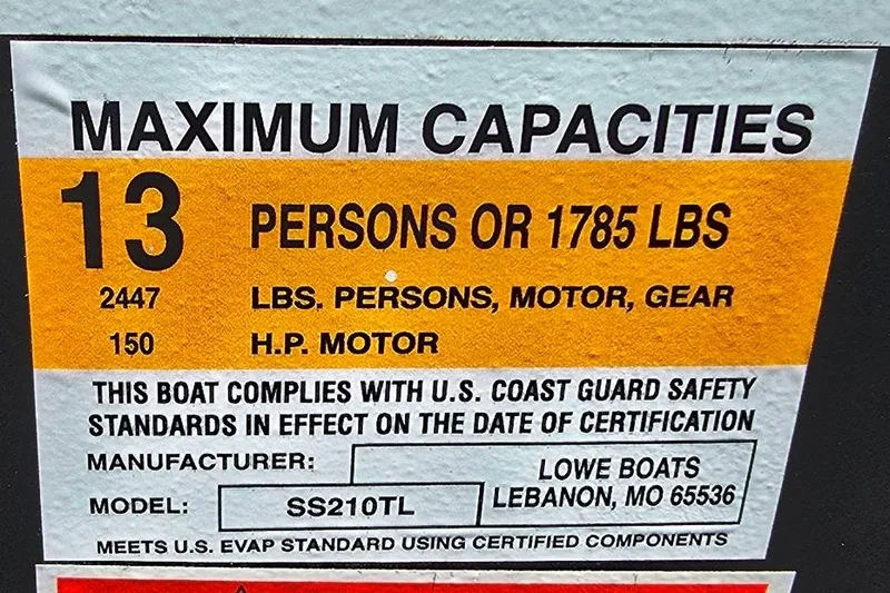Slide: The Image of 2023 Lowe SS 210 boat capacity label: 13 persons or 1785 lbs, 150 HP motor. - 13