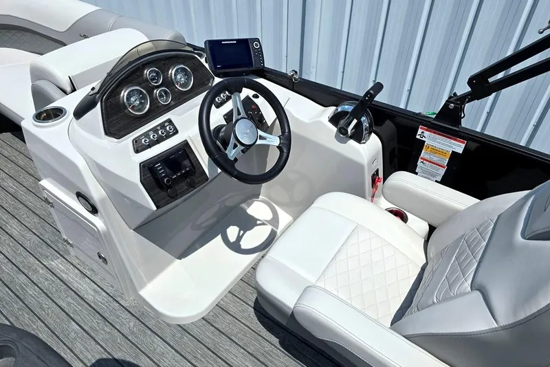 Slide: The Image of 2023 Lowe SS 210 boat cockpit with modern steering and controls. - 3