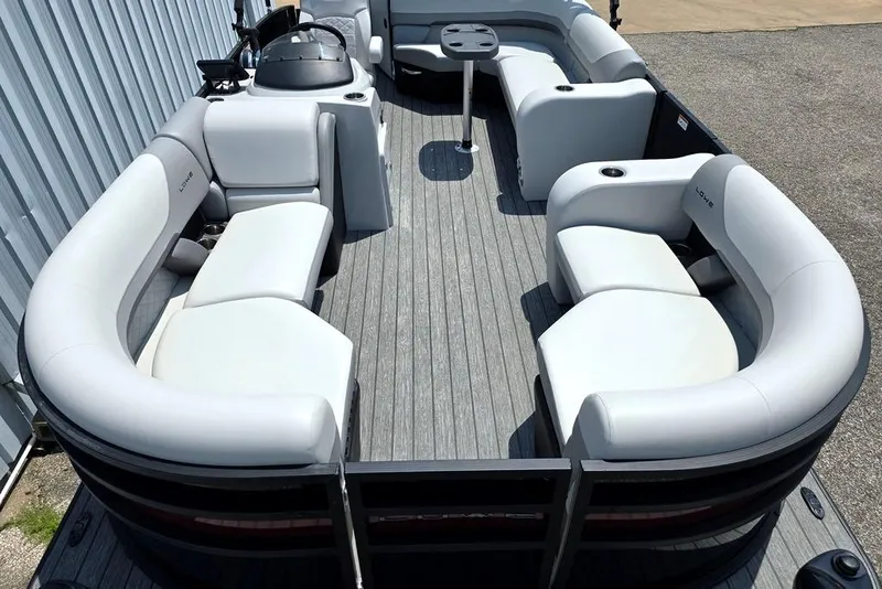 Slide: The Image of 2023 Lowe SS 210 pontoon boat with spacious seating and modern design. - 2