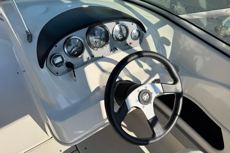 Slide: The Image of Steering wheel and dashboard of a 2008 Sea Ray 205 Sport boat. - 28