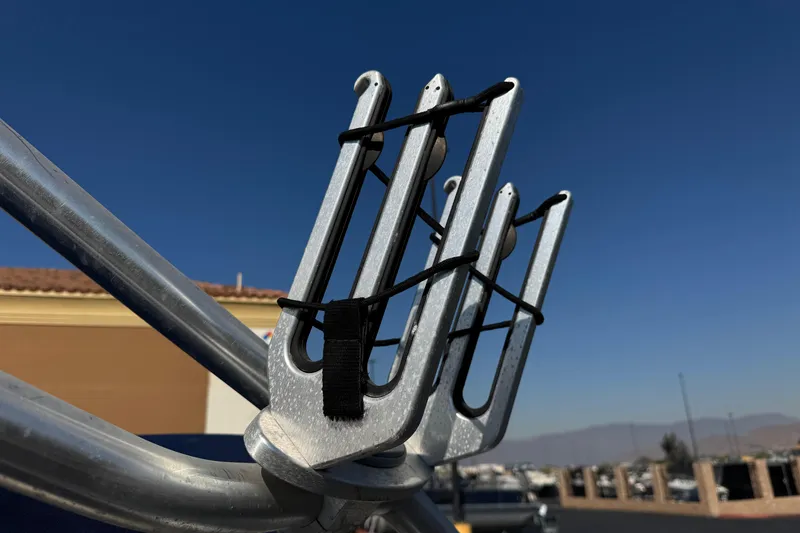 Slide: The Image of Wakeboard rack on a 2008 Sea Ray 205 Sport boat under clear blue sky. - 17