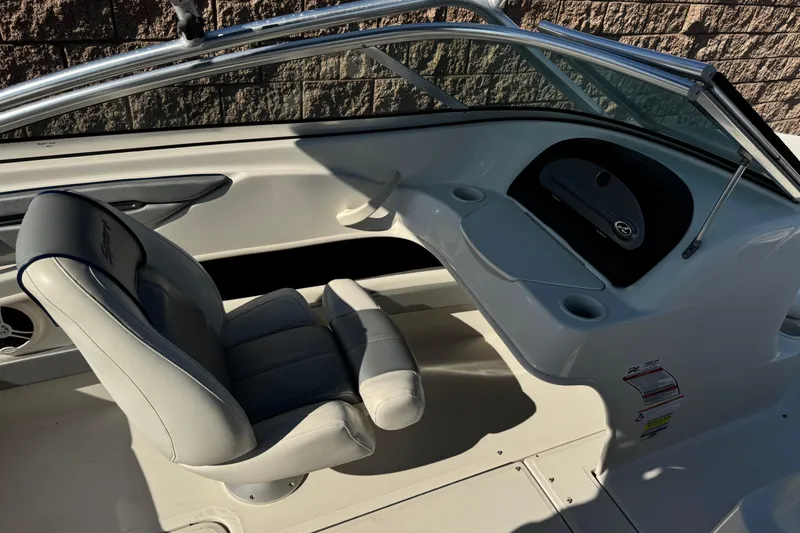 Slide: The Image of 2008 Sea Ray 205 Sport boat interior with seating and dashboard details. - 24