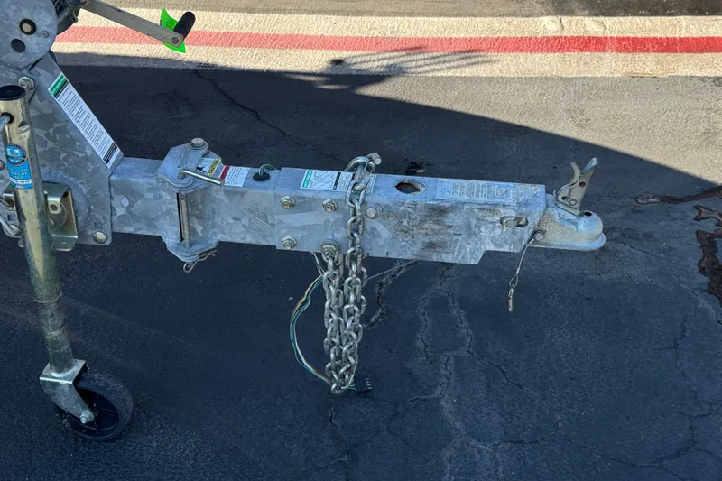 Slide: The Image of Trailer hitch of a 2008 Sea Ray 205 Sport boat on pavement. - 30