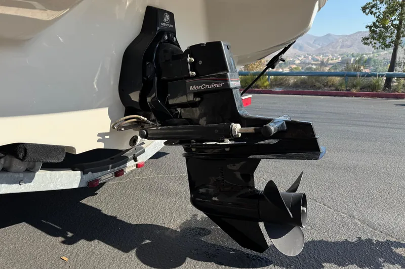 Slide: The Image of 2008 Sea Ray 205 Sport boat with MerCruiser engine, parked outdoors. - 7