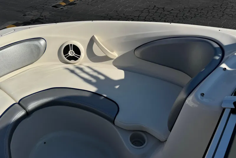 Slide: The Image of Interior seating of a 2008 Sea Ray 205 Sport boat with speaker and cup holder. - 14