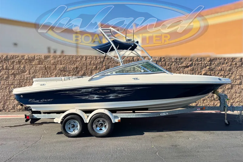 The Image of 2008 Sea Ray 205 Sport boat on trailer, displayed outdoors at Inland Boat Center. - 0