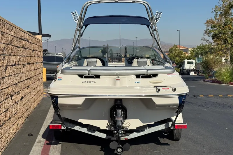 Slide: The Image of 2008 Sea Ray 205 Sport boat on trailer, parked outdoors, rear view. - 4