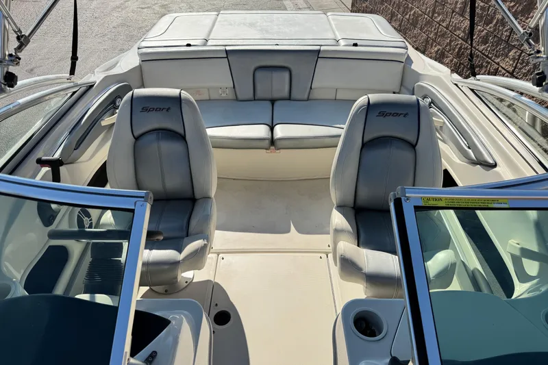 Slide: The Image of 2008 Sea Ray 205 Sport boat interior with seating and steering wheel. - 15