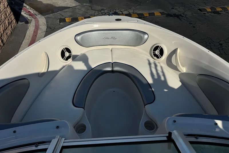 Slide: The Image of 2008 Sea Ray 205 Sport boat interior with seating and speakers. - 12