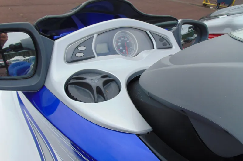 Slide: The Image of 2006 Yamaha WaveRunner FX dashboard with mirrors and speedometer, featuring sleek blue and white design. - 12