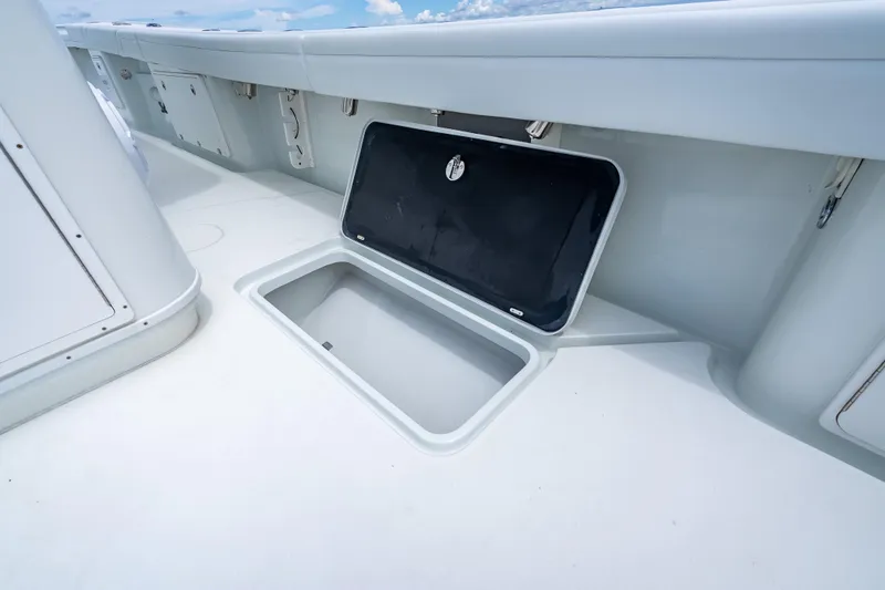 Slide: The Image of 2016 Yellowfin 39 Offshore boat storage compartment open on deck. - 57