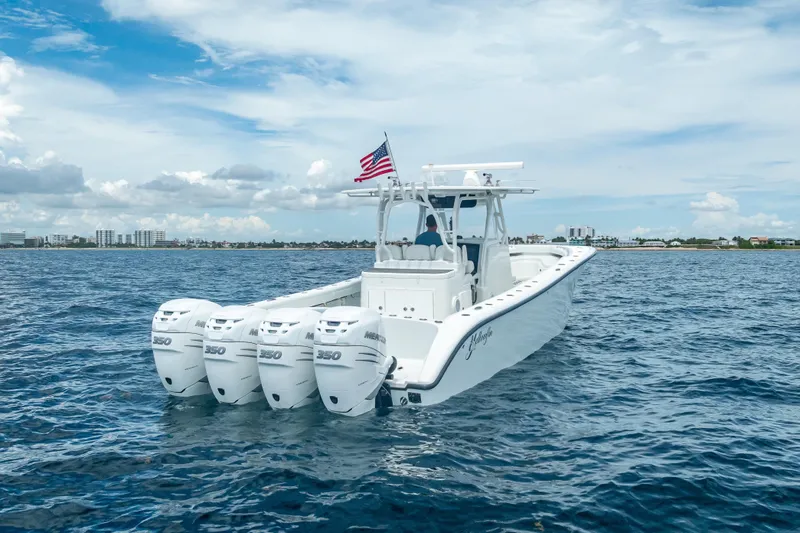 Slide: The Image of 2016 Yellowfin 39 Offshore boat with quad Mercury 350 engines on open water. - 19