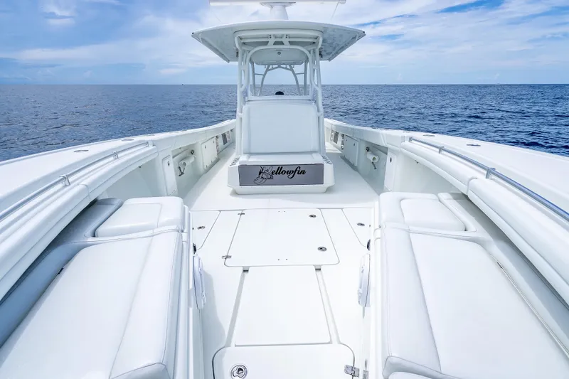 Slide: The Image of 2016 Yellowfin 39 Offshore boat on open sea, showcasing spacious deck and sleek design. - 43