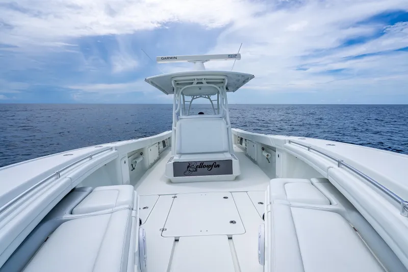 Slide: The Image of 2016 Yellowfin 39 Offshore boat on open sea under blue sky. - 46