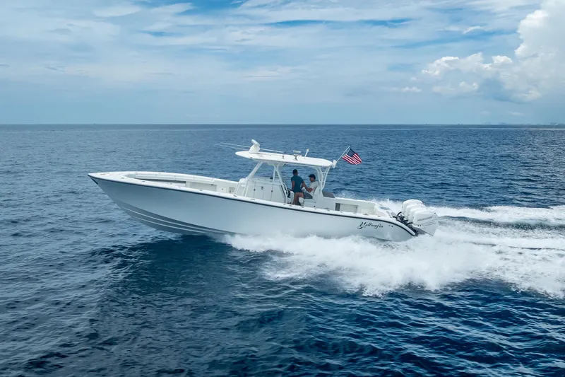 Slide: The Image of 2016 Yellowfin 39 Offshore boat cruising on open ocean under clear sky. - 9