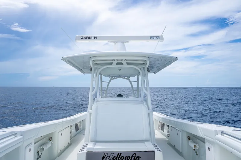 Slide: The Image of 2016 Yellowfin 39 Offshore boat on open sea under blue sky. - 44