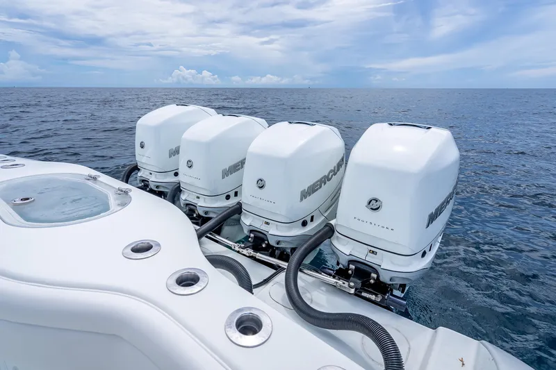 Slide: The Image of 2016 Yellowfin 39 Offshore boat with four Mercury outboard engines on open sea. - 39