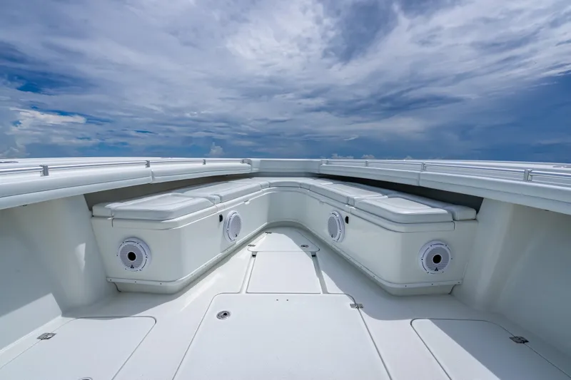 Slide: The Image of 2016 Yellowfin 39 Offshore boat deck with seating under a cloudy sky. - 42