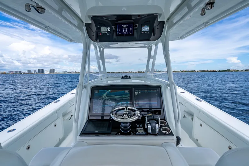 Slide: The Image of 2016 Yellowfin 39 Offshore boat cockpit with advanced navigation system on open water. - 22