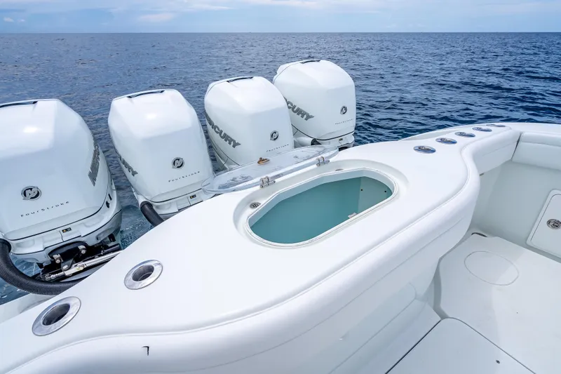 Slide: The Image of 2016 Yellowfin 39 Offshore boat with four Mercury engines on open sea. - 37